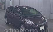 Хэтчбек гибрид HONDA FIT HYBRID кузов GP1 модификация Hybrid XH ION гв 2012 пробег 85 т.км темно-кра Москва