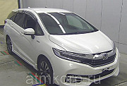 Универсал гибрид Honda SHUTTLE HYBRID кузов GP7 модификация X гв 2016 пробег 58 т.км белый Москва