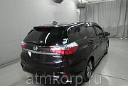 Универсал гибрид Honda SHUTTLE HYBRID кузов GP7 модификация X гв 2016 пробег 62 т.км пурпурный Москва