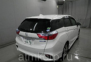 Универсал гибрид Honda SHUTTLE HYBRID кузов GP8 4WD модификация X гв 2015 пробег 64 т.км белый жемчу Москва