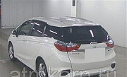 Универсал гибрид Honda SHUTTLE HYBRID кузов GP8 4WD модификация Z AWD гв 2015 пробег 33 т.км белый ж Москва