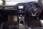 Универсал гибрид Honda SHUTTLE HYBRID кузов GP8 4WD модификация Z гв 2015 пробег 49 т.км пурпурный Москва