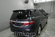 Минивэн 4WD 8 мест Honda Odyssey кузов RC2 пятого поколения Absolute гв 2014 пробег 111 т.км пурпурн Москва