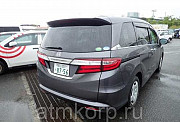 Минивэн 4WD 8 мест Honda Odyssey кузов RC2 пятого поколения модификация B гв 2014 пробег 62 т.км сер Москва